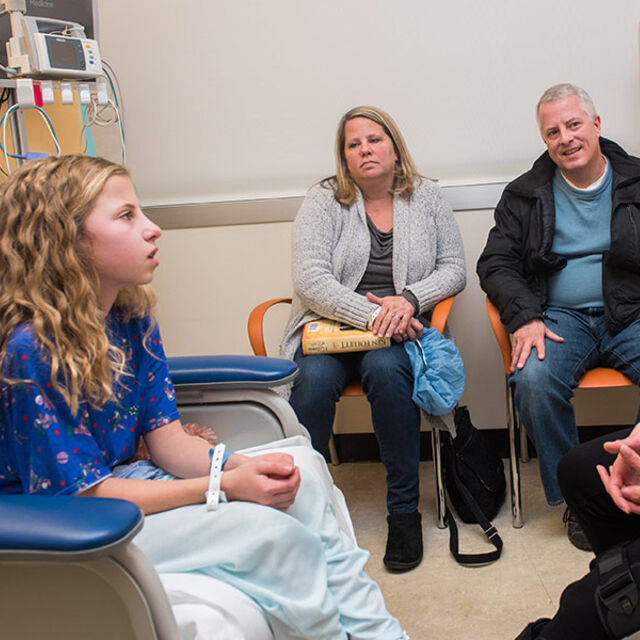 Patient Maeve O’Grady and her parents meet with Hilary Jericho, MD