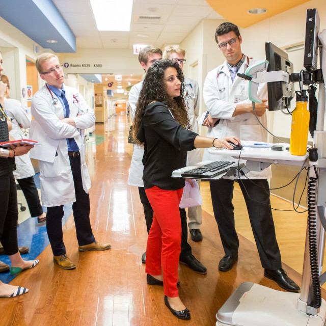 Doctors look at a screen