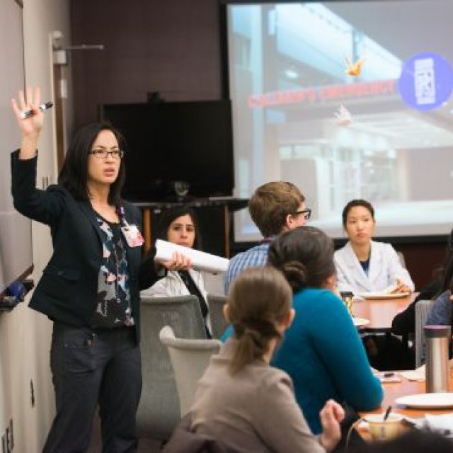 Alisa McQueen, MD, giving a presentation